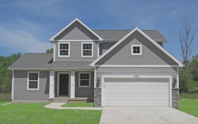 craftsman inspired home featuring board and batten siding, a front yard, a garage, stone siding, and driveway