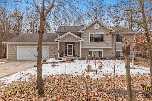 split level home with a garage and driveway