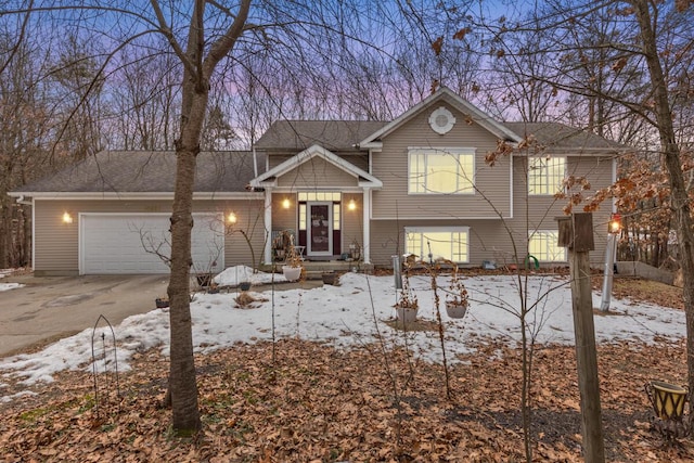 view of front of house with concrete driveway and an attached garage