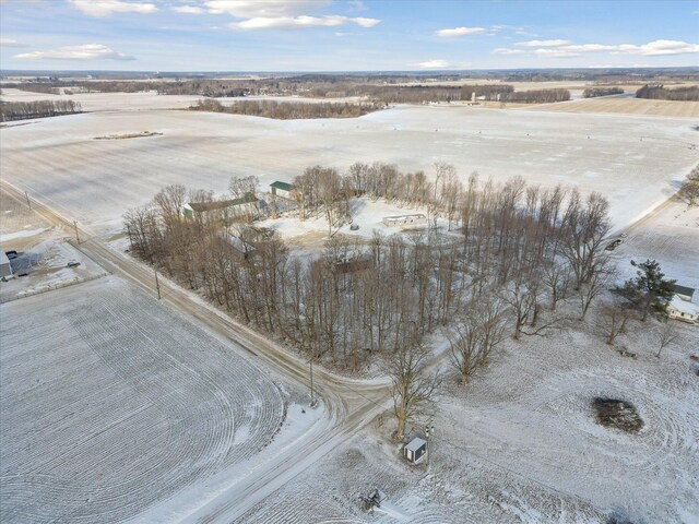 snowy aerial view featuring a rural view
