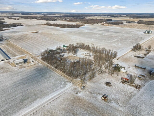 snowy aerial view with a rural view