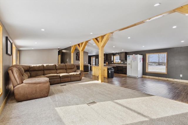 living room with baseboards, dark wood-type flooring, dark carpet, and recessed lighting