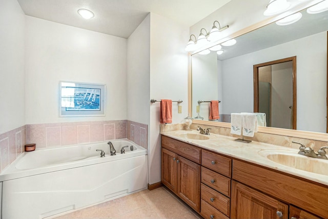 bathroom with tile patterned flooring, a sink, a bath, and double vanity