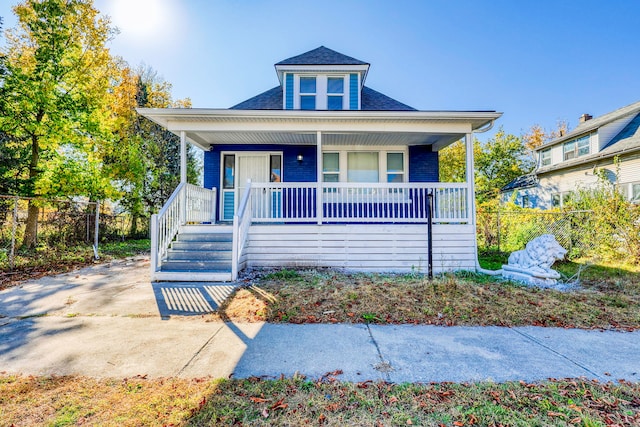 bungalow with fence and a porch