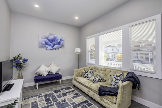 living room featuring recessed lighting, dark wood finished floors, and baseboards