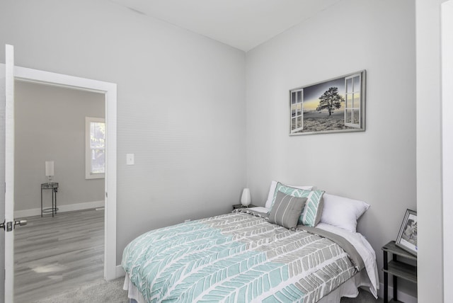 bedroom featuring baseboards