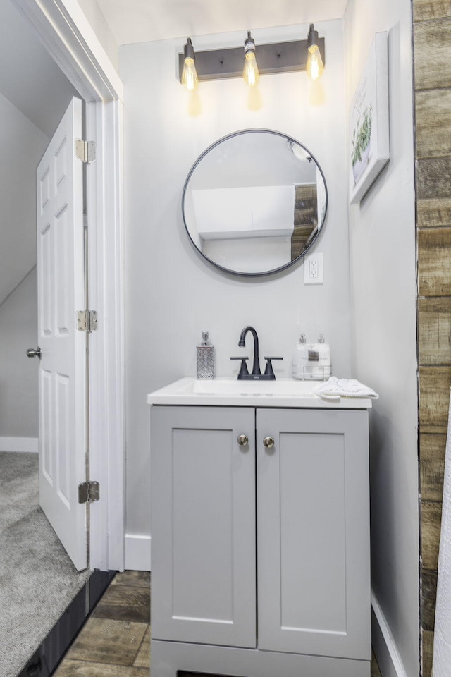 bathroom with baseboards and vanity