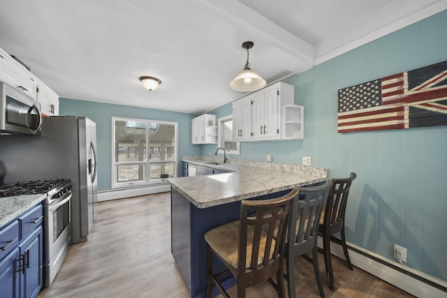 kitchen with stainless steel appliances, baseboard heating, white cabinetry, and open shelves