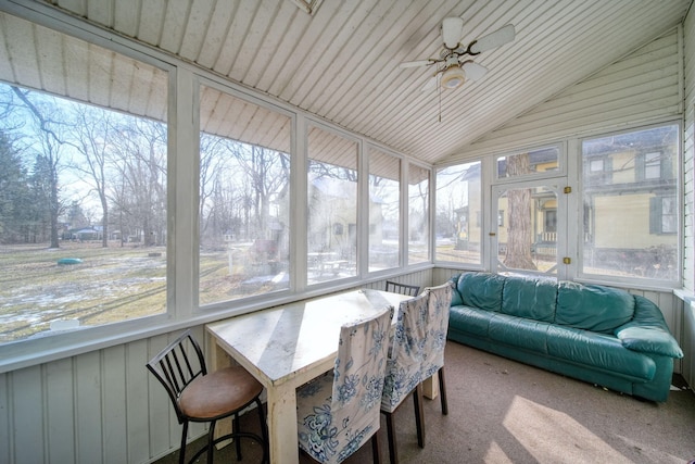 sunroom / solarium featuring vaulted ceiling, ceiling fan, and a wealth of natural light