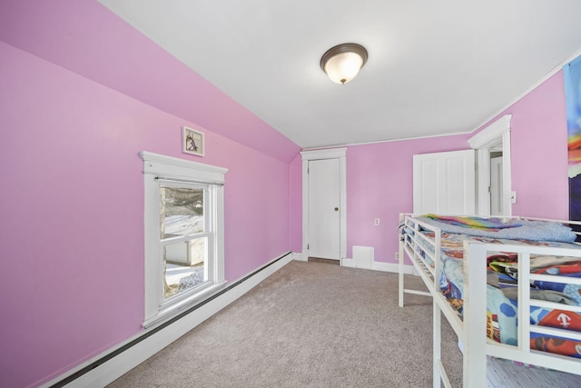 carpeted bedroom with baseboards, a baseboard heating unit, and vaulted ceiling