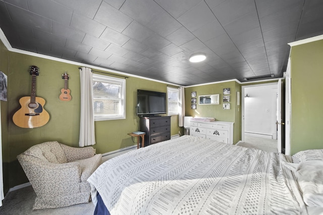 bedroom with ornamental molding, carpet, and a baseboard radiator