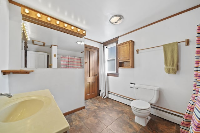 full bathroom featuring toilet, baseboards, a baseboard heating unit, and vanity