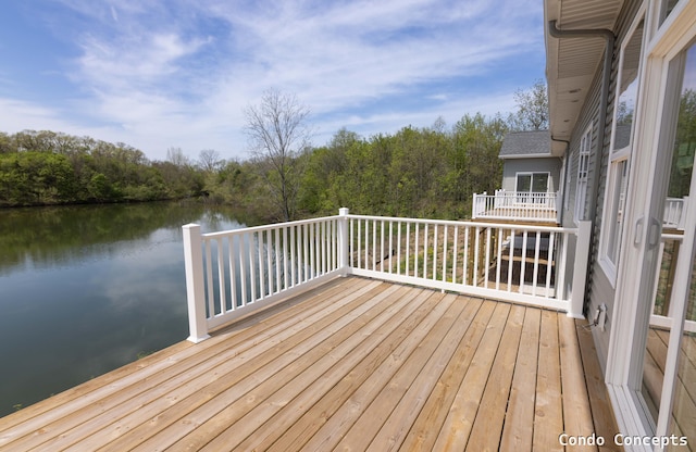 6625 Shoreside Ct SE, Grand Rapids, MI 49548 - deck with a water view and a view of trees