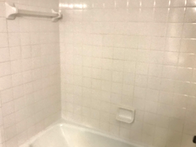 full bathroom with shower / washtub combination