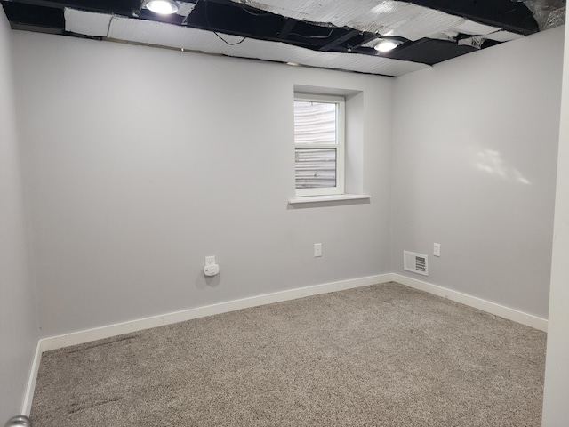 interior space featuring carpet, visible vents, and baseboards