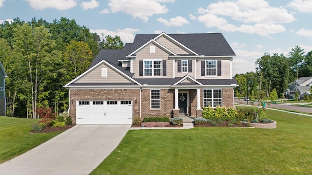 craftsman-style house featuring a garage, a front yard, concrete driveway, and brick siding