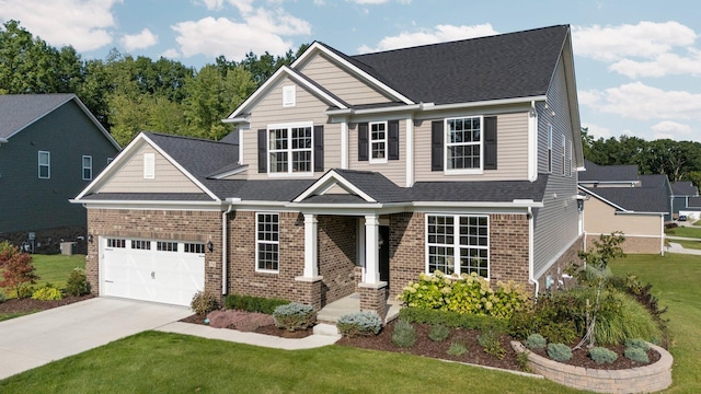 view of front of home featuring concrete driveway, brick siding, and a front yard