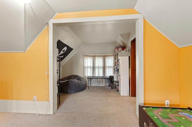 bonus room featuring carpet and vaulted ceiling