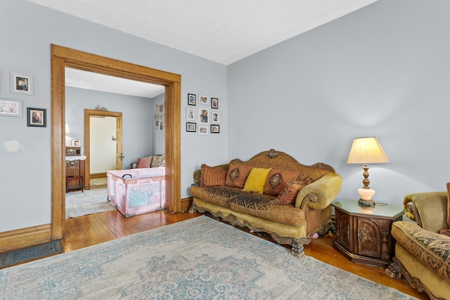 interior space with wood-type flooring and baseboards