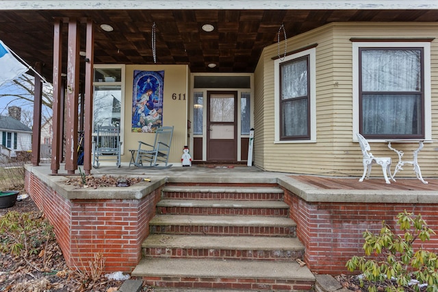 doorway to property featuring a porch