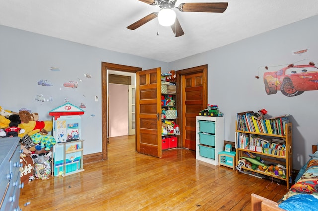 bedroom with hardwood / wood-style flooring and ceiling fan