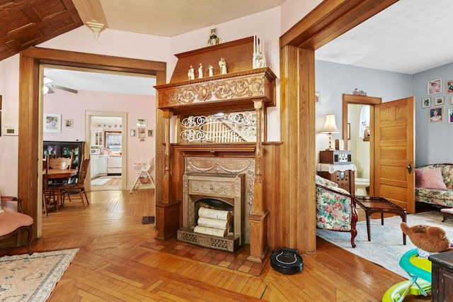 living area with parquet floors and a fireplace