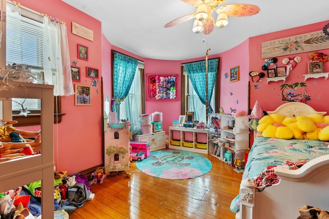 bedroom featuring ceiling fan and hardwood / wood-style floors