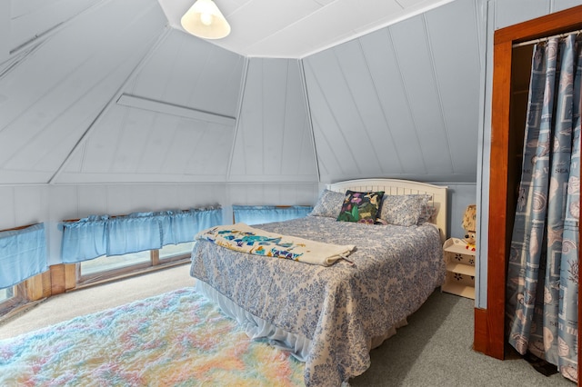 bedroom with carpet and vaulted ceiling