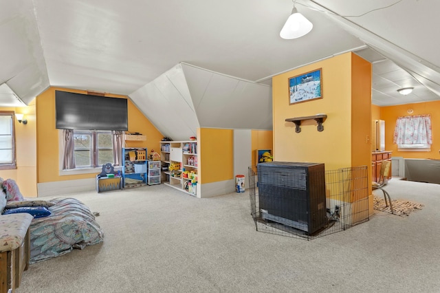 rec room featuring lofted ceiling and carpet flooring