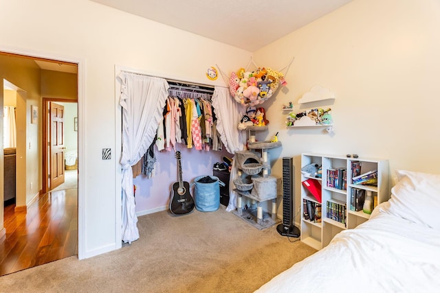 7016 Hyde Park Rd, Whitehall, MI 49461 - bedroom with carpet, baseboards, and a closet