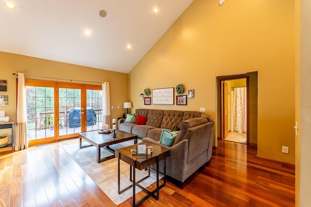 7016 Hyde Park Rd, Whitehall, MI 49461 - living area with high vaulted ceiling, french doors, wood finished floors, and recessed lighting