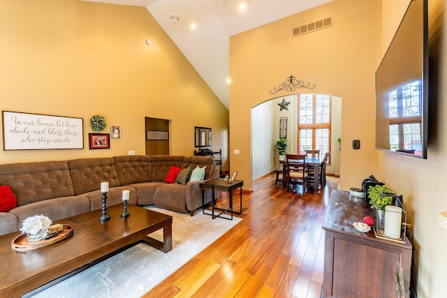 7016 Hyde Park Rd, Whitehall, MI 49461 - living room with high vaulted ceiling, light wood-style floors, and arched walkways