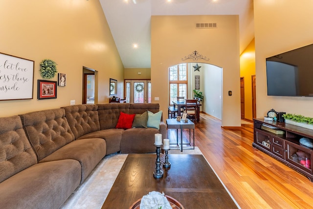 7016 Hyde Park Rd, Whitehall, MI 49461 - living room featuring high vaulted ceiling, wood finished floors, baseboards, and recessed lighting