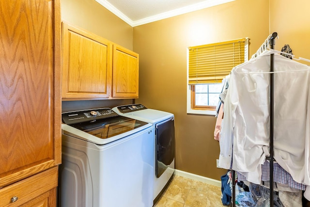 7016 Hyde Park Rd, Whitehall, MI 49461 - laundry room featuring separate washer and dryer, cabinet space, ornamental molding, and baseboards