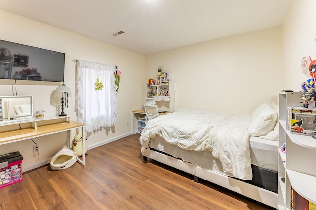 7016 Hyde Park Rd, Whitehall, MI 49461 - bedroom featuring wood finished floors and baseboards
