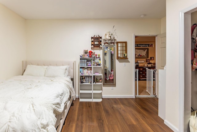 7016 Hyde Park Rd, Whitehall, MI 49461 - bedroom with wood finished floors and baseboards