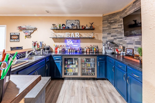 7016 Hyde Park Rd, Whitehall, MI 49461 - indoor bar featuring beverage cooler, ornamental molding, and light wood-type flooring