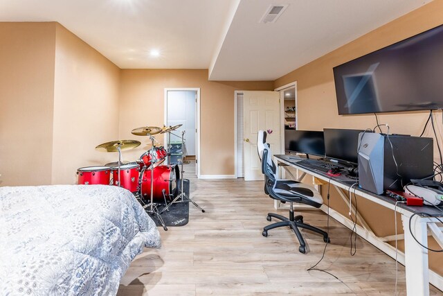 7016 Hyde Park Rd, Whitehall, MI 49461 - bedroom featuring wood finished floors, baseboards, a desk, and recessed lighting