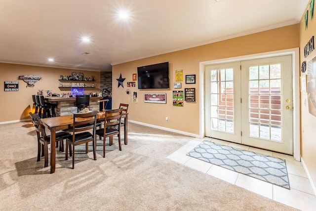 7016 Hyde Park Rd, Whitehall, MI 49461 - dining room with ornamental molding, light colored carpet, baseboards, recessed lighting, and a bar