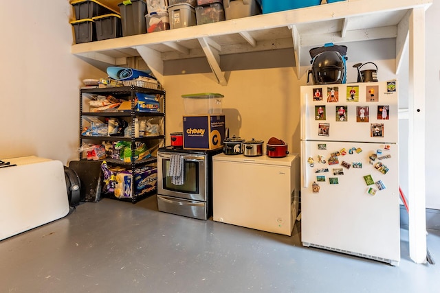 7016 Hyde Park Rd, Whitehall, MI 49461 - kitchen with freestanding refrigerator and concrete floors