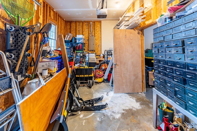 7016 Hyde Park Rd, Whitehall, MI 49461 - garage with a garage door opener and electric panel