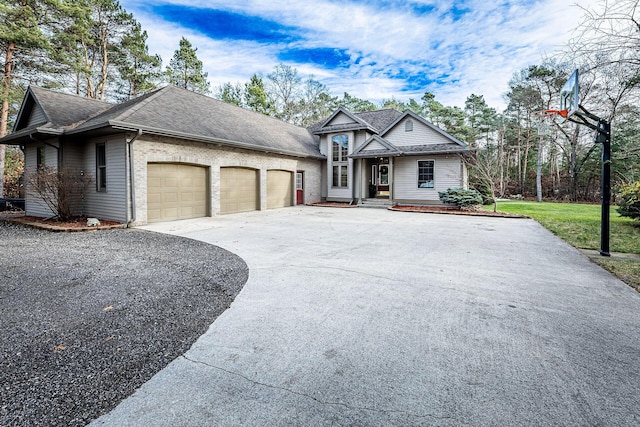 7016 Hyde Park Rd, Whitehall, MI 49461 - view of front of home with an attached garage, driveway, and a shingled roof