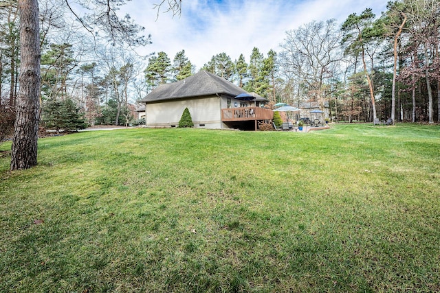 7016 Hyde Park Rd, Whitehall, MI 49461 - view of grassy yard with a deck