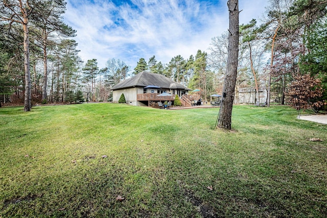 7016 Hyde Park Rd, Whitehall, MI 49461 - view of grassy yard featuring a wooden deck