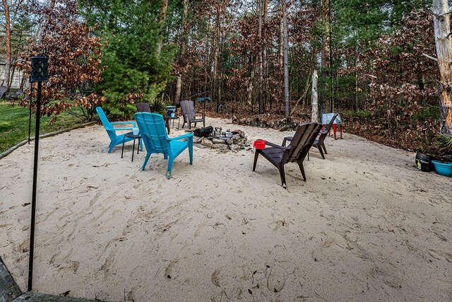 7016 Hyde Park Rd, Whitehall, MI 49461 - surrounding community with a fire pit and a patio area