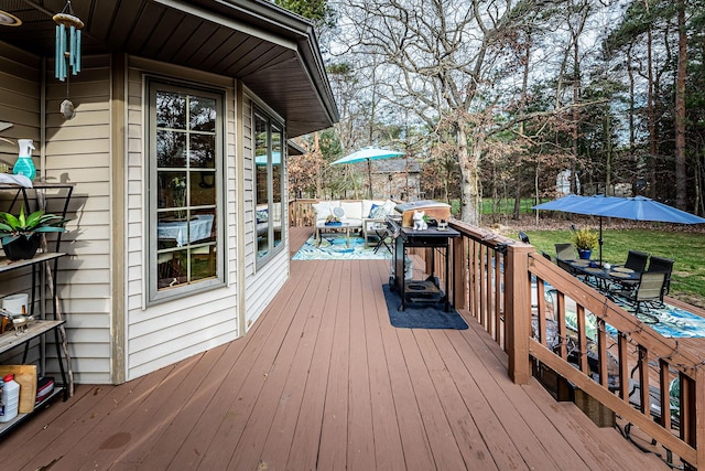 7016 Hyde Park Rd, Whitehall, MI 49461 - wooden terrace featuring outdoor dining space, an outdoor hangout area, and view of scattered trees