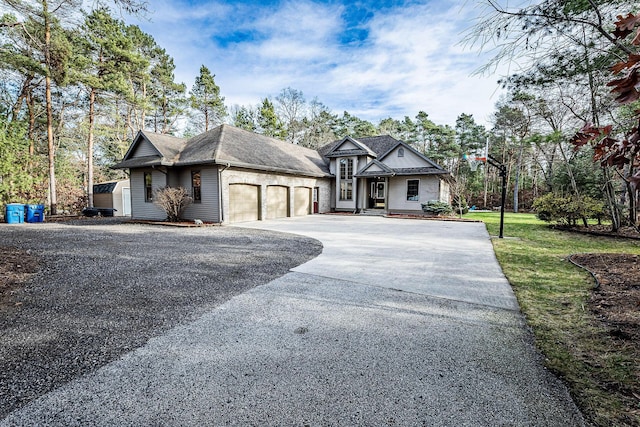 7016 Hyde Park Rd, Whitehall, MI 49461 - view of front of property with an attached garage, concrete driveway, a shingled roof, and a front lawn