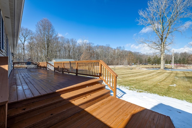 wooden terrace with a lawn