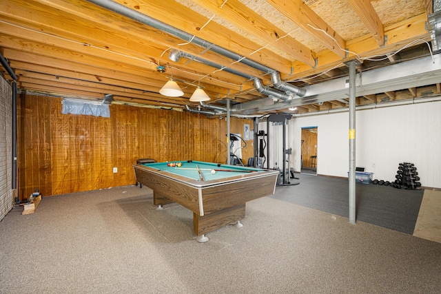 rec room with wood walls and billiards