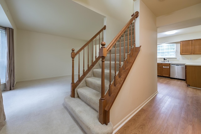3048 Turnberry Ln, Ann Arbor, MI 48108 - staircase with baseboards and wood finished floors